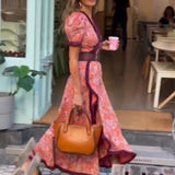 Miriam - Elegante vestido largo con mangas cortas abullonadas y falda asimétrica